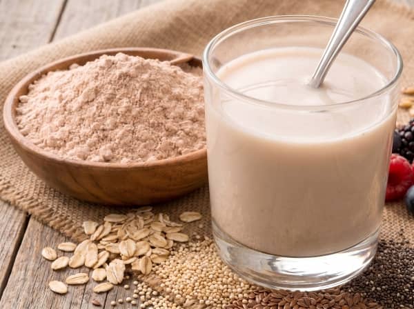Instant multi-grain meal replacement powder made from extruded quinoa and oat flours.